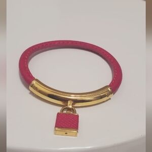 Pink Leather Fashion Padlock Bracelet with featured Gold Tone Closure. 🌴